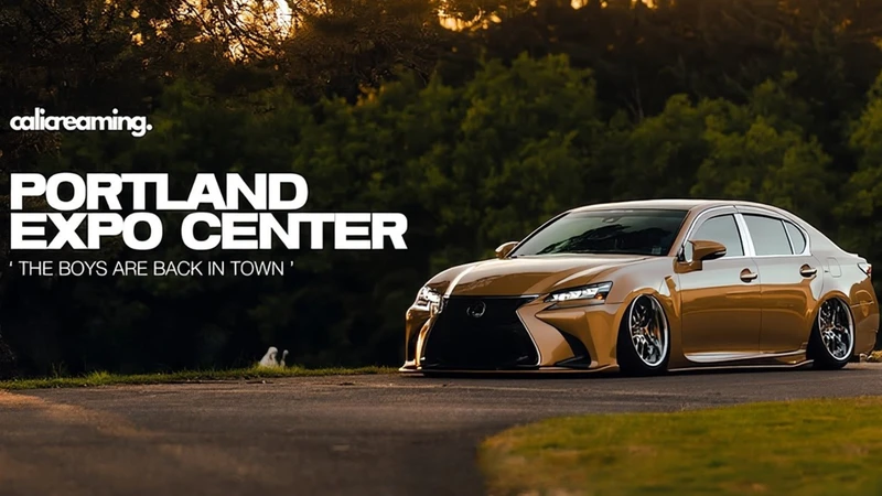 A gold-colored, modified luxury sedan with lowered suspension is parked on a paved area surrounded by grass and trees. The car has large chrome wheels and a sleek, polished finish. On the left side of the image, bold white text reads “PORTLAND EXPO CENTER” with smaller text underneath saying “THE BOYS ARE BACK IN TOWN.” Above that, the logo “calicreaming.” appears in white. The background shows dense greenery and soft evening light, creating a warm, outdoor setting.