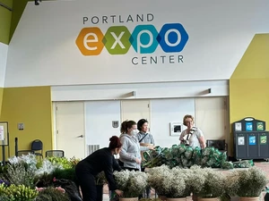 loading in the floral exhibit at the Spring Home & Garden Show
