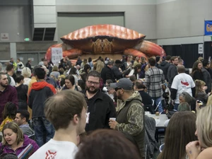 An overhead shot of the crowd at the seafood & wine fest with a large inflatable crab in the background